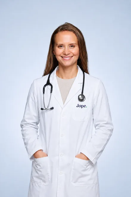 Dr. Christine, veterinarian and co-founder of Pet Evidence, in a white lab coat