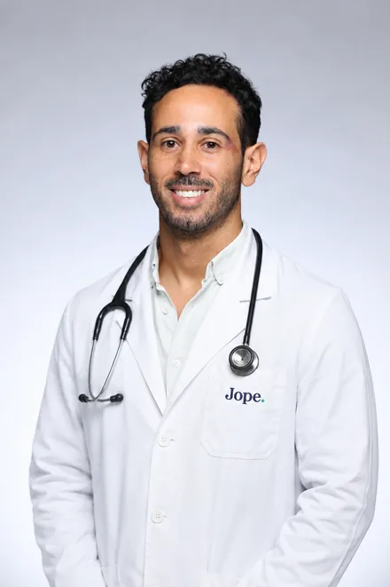 Dr. Jeremy, veterinarian and co-founder of Pet Evidence, in a white lab coat